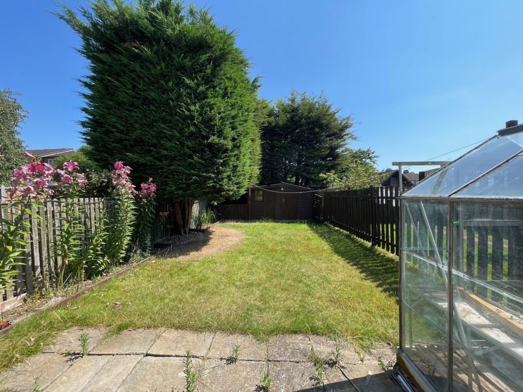 Lot: 27 - THREE-BEDROOM TERRACE HOUSE FOR IMPROVEMENT - patio leading to lawn area